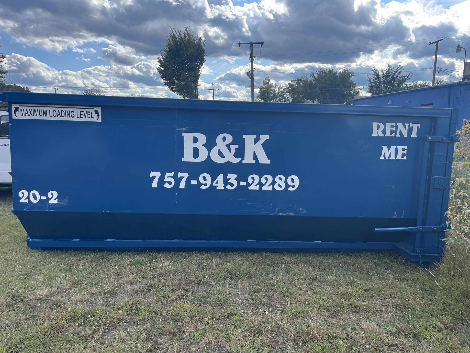 Roll Off Dumpsters And Bobcat Or Excavator Loading