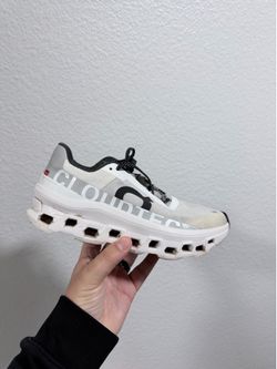 On cloud white and black women running shoes