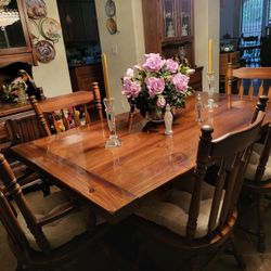 Dining room set table 2 leaves not in picture 6 chairs, dry bar, large China, hutch and accustomed table cover for heat.All perfect works great wood