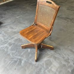 Antique Swivel Chair With Caned Back And Brass Plates