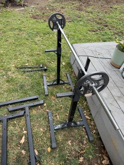Square rack, two 10lbs standard plates and one standard weighted barbell.