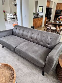 Grey faux leather sofa