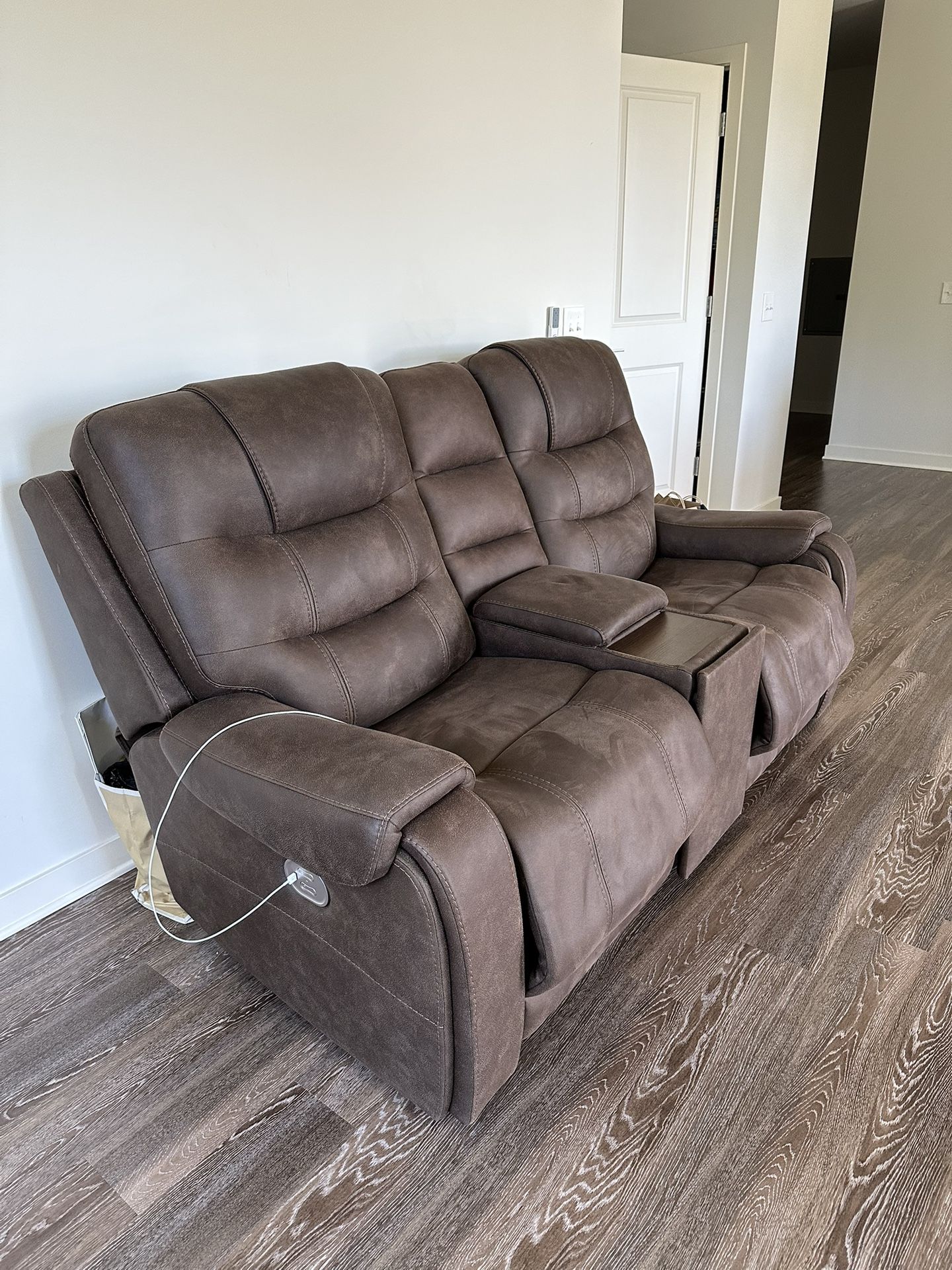 Reclining leather couch with phone chargers