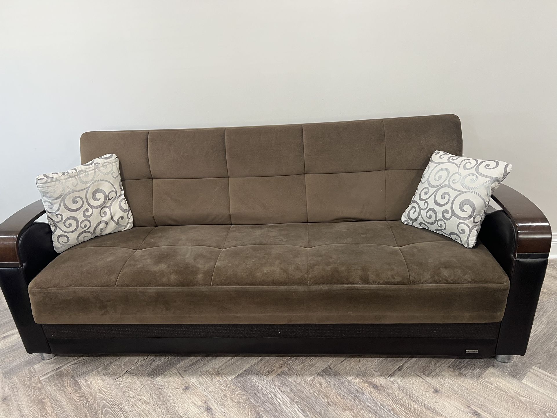 Selling a dark brown sofa set: includes 1 large sofa, 1 loveseat (seats two), and 1 armchair. All pieces have built-in storage.