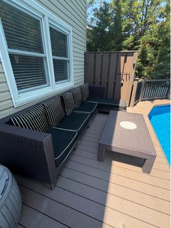 FREE outdoor sectional with table and cushions. I’m in Lido Beach.   come take it. The legs just need to be replaced.