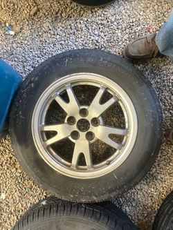 195–65 – R 15 Michelin defender tire mounted on five lug rim