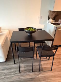 Black table with 4 chairs
