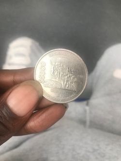 5000 peso coin & 5 peso coin