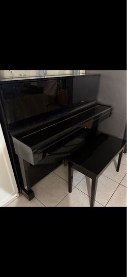 Black Upright Piano with Bench