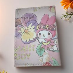 🌸 Travel with a touch of floral magic with this dreamy My Melody passport wallet! 🌸