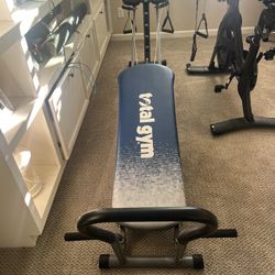 Total gym Elite.  Pilates Attachments Included