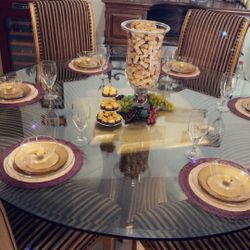 Golden round glass table with five wooden Golden chairs