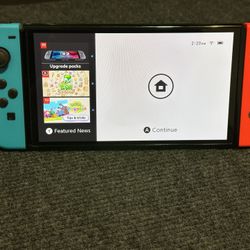 Nintendo Switch Oled. With Super Smash Bros Ultimate 
