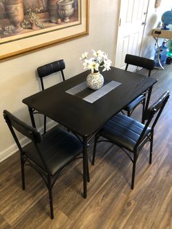 Black dining table set with 4 black leather chairs