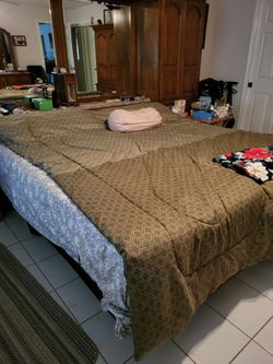 King size bed, (2) box springs and king size mattress.
