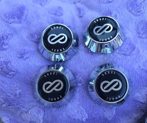 Set of 4 original Enkei Wheel Center Caps.
