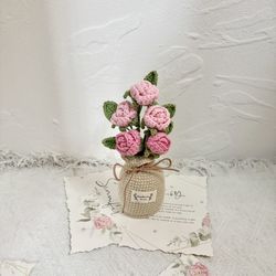 Crocheted pink roses in a crochet vase