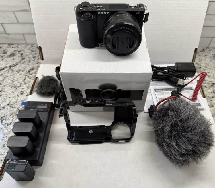 Sony zv-e10 camera W/Lens, Rode Mic, 4 Batteries, & Small Rig Cage. Lightly Used