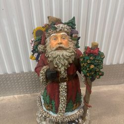 Santa bearing  gifts decorating statue… solid and steady … 37” tall. $60