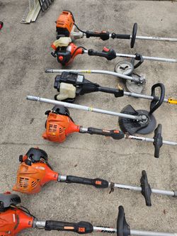 Several weed trimmers