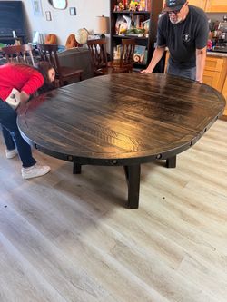 Large Round Dark Wood Dining Table