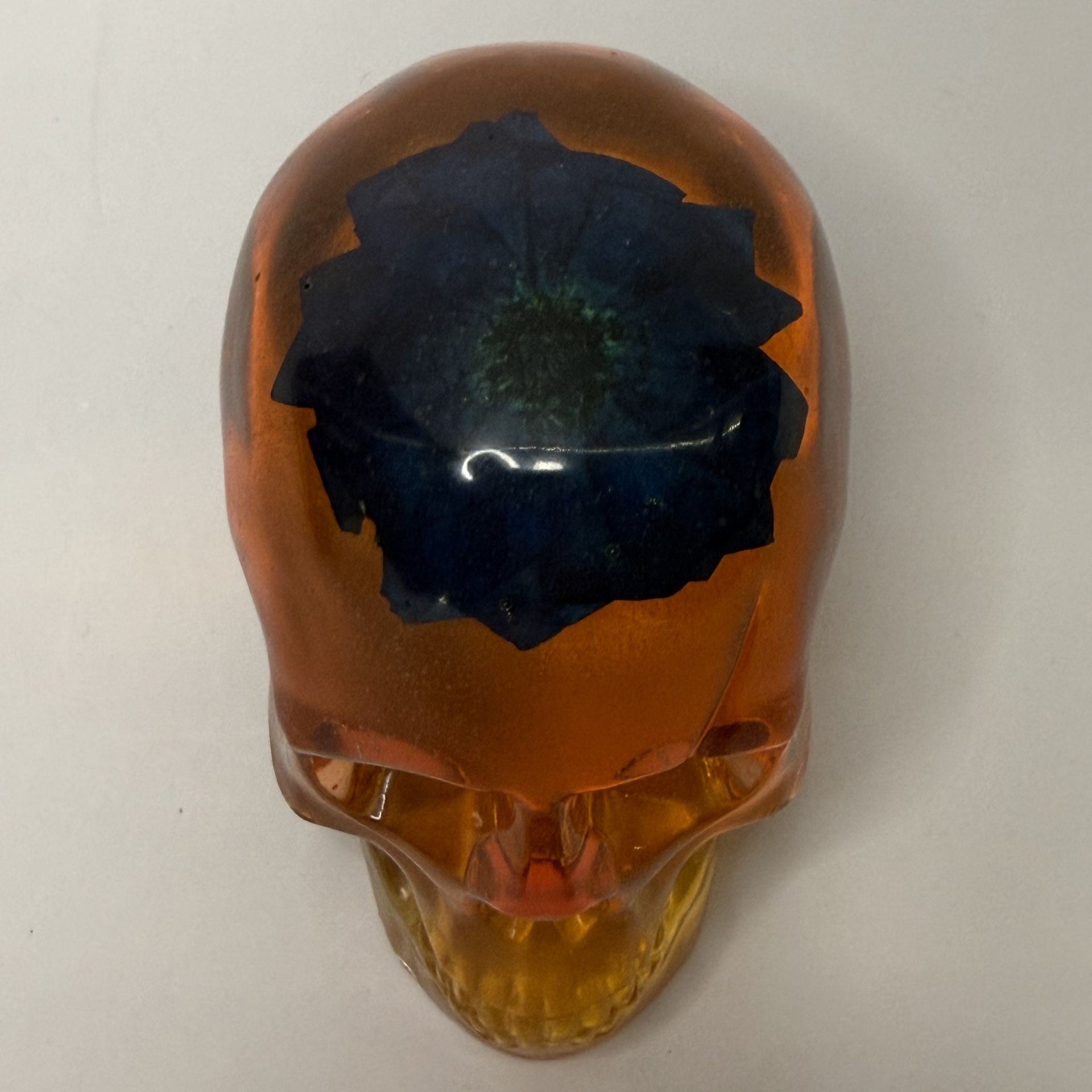 Handmade Epoxy Resin Skull – Orange, Yellow & Blue with Bold Flower – Campy Tchotchke Paperweight