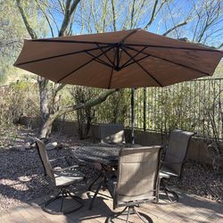 Overhang umbrella with patio table set