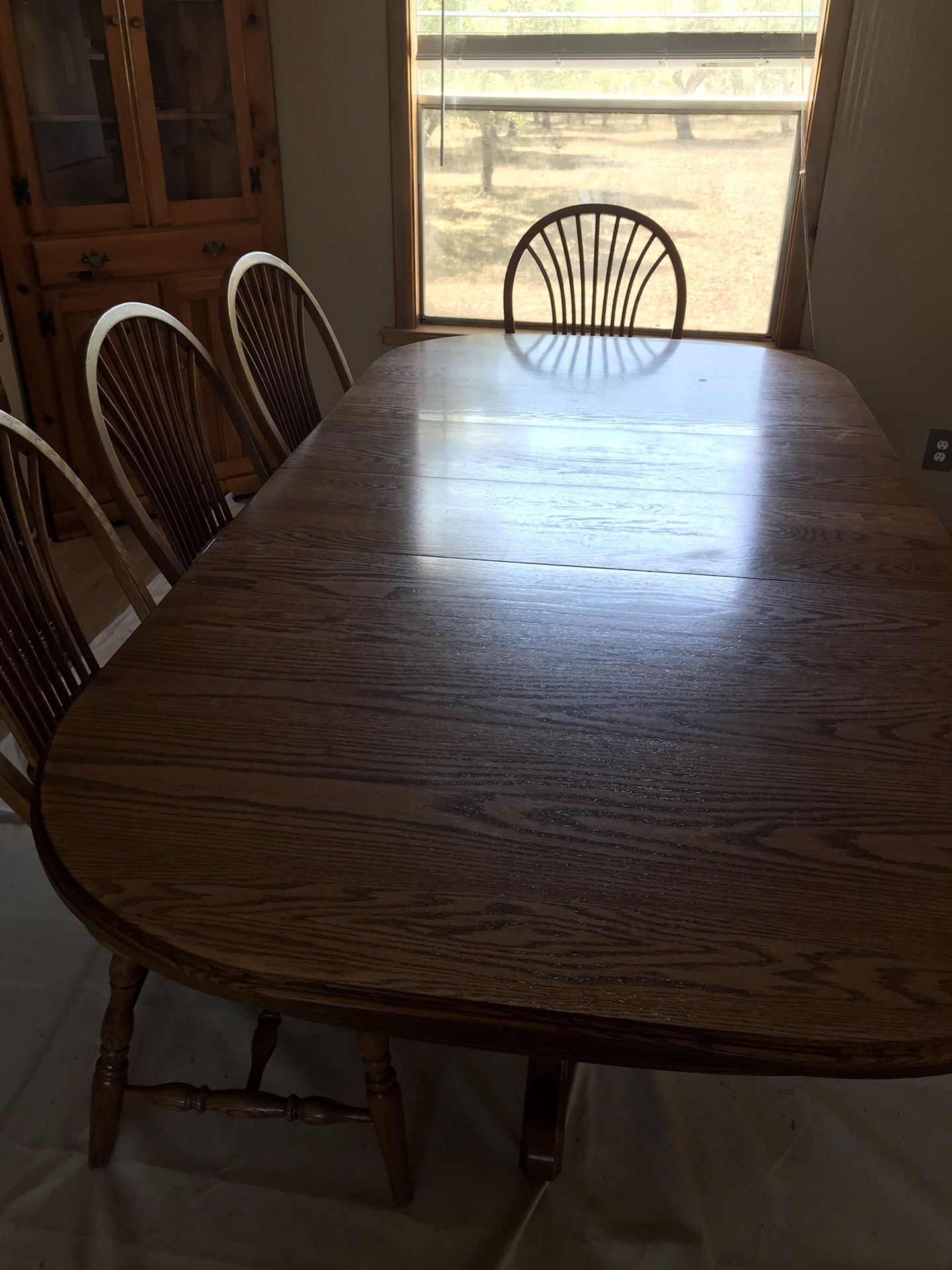 Solid wood table with two leads and four chairs