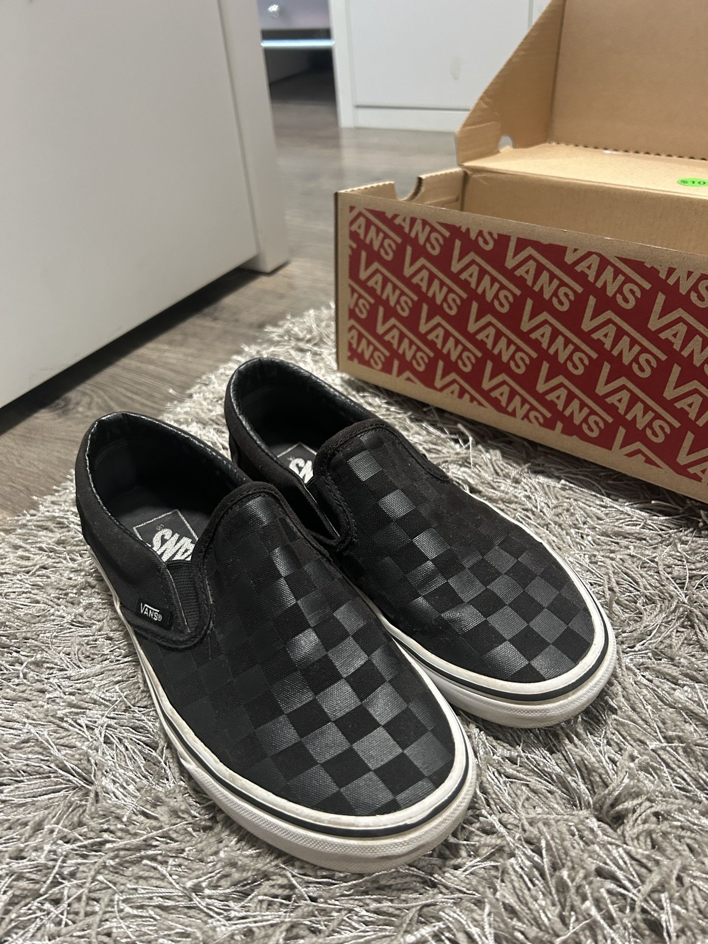 All black checkered vans