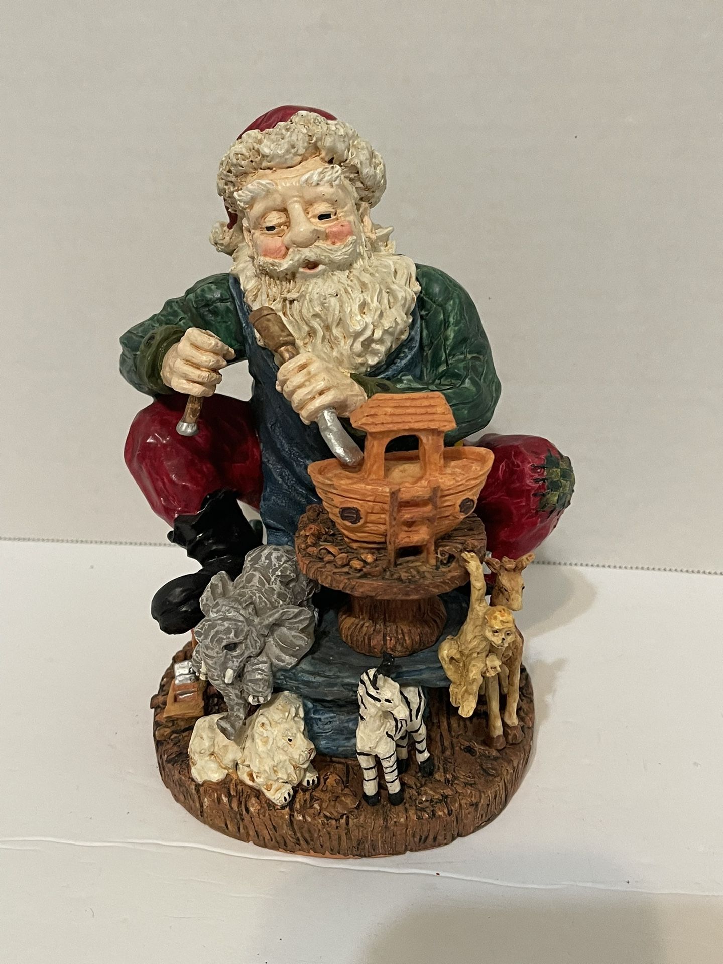 Santa figurine carving Noah’s Arc. 7.5” high made of resin. 