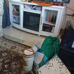 Fireplace glass doors storage entertainment cabinet.About 48 /50 " Stereo equipment. long TV.
Entertainment