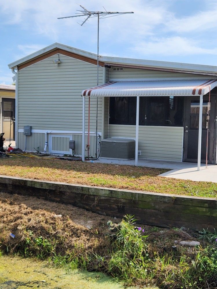 MANUFACTURED HOME AND PERIMETER LOT IN HOLIDAY CONDO PARK (16410 SAN CARLOS BLVD.)