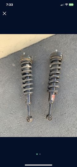 Toyota Fj Front Struts With 2 Inch Leveling Spacer.