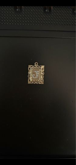 10K gold initial letter charm pendant. It is miss the bale. it weighs 1.3 g