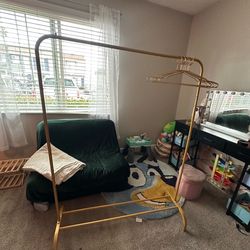 BRAND NEW GOLD CLOTHES RACK $30 OBO