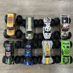 Set of 8 monster jam trucks from hot wheels. These are the bigger 1/24 scale trucks. 