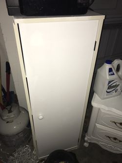 White storage unit (has shelves inside)
