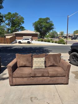 Brown couches with a pull out queen matress