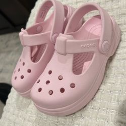 Pink Crocs.  
