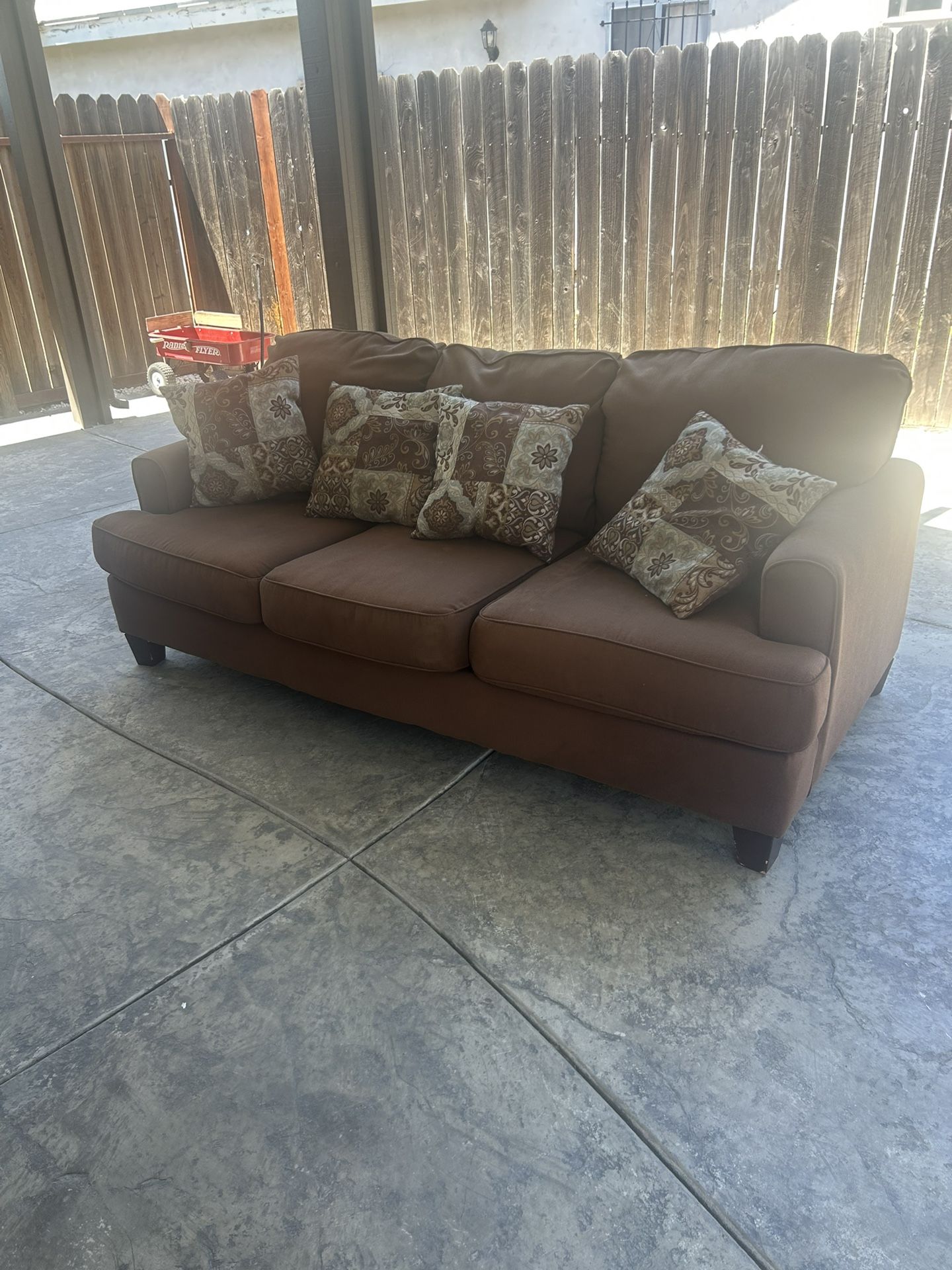 Brown Couch Including Pillows Used