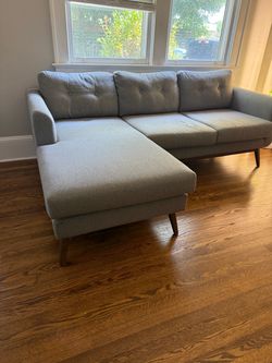 Grey couch w/ reversible chaise for sale