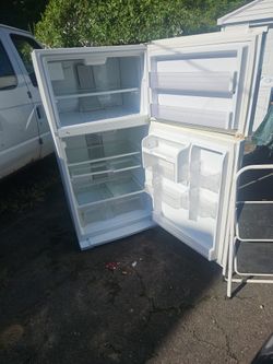 Whirlpool Fridge runs perfectly...fridge Has wheels for easy moving