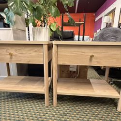 Modern Oak Nightstand A stylish and functional nightstand featuring a spacious drawer, open storage shelf, and sturdy solid wood legs. The natural oak