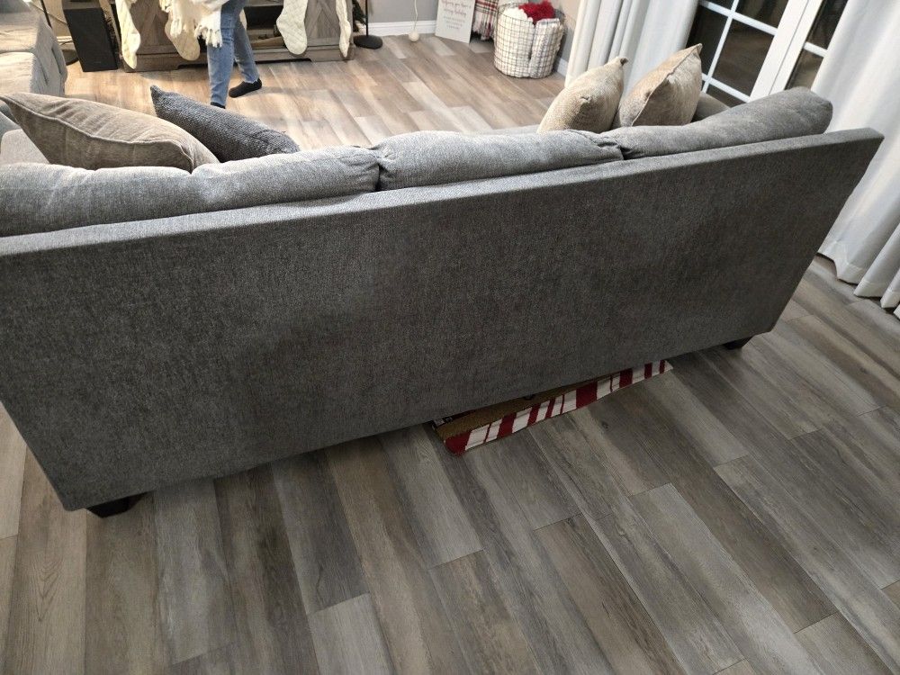 sofa and love seat gray with 4 pillows