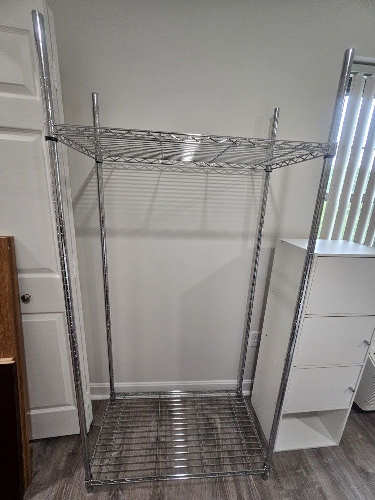 2 like new Metal 2 Adjustable shelve Garment Rack