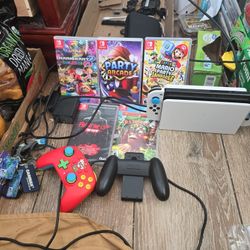 NINTENDO SWITCH OLED WITH MARIO KART, DONKEY KONG COUNTRY, MARIO PARTY JAMBOREE,  FRIDAY THE 13TH AND PARTY ARCADE 