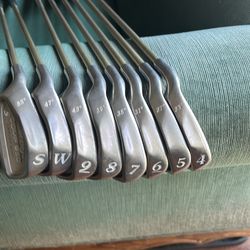 Left Hand Tour Edge golf irons 4-SW regular graphite shafts.