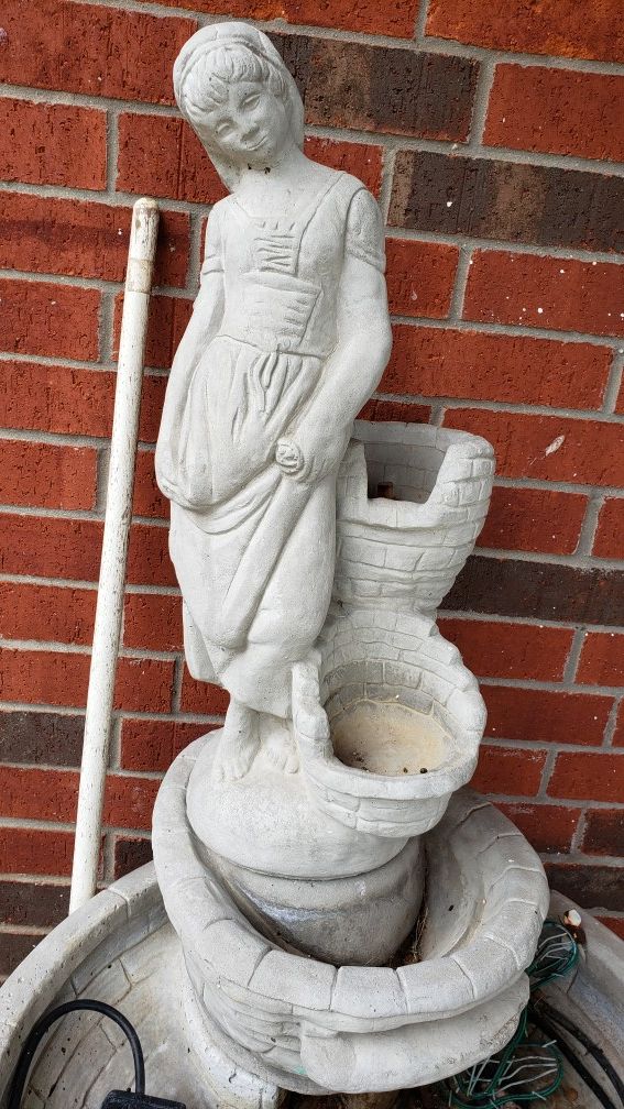 Concrete fountain with statue