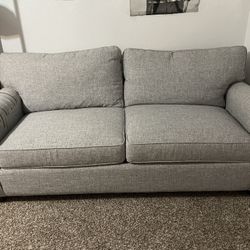 light grey couch- pull out bed