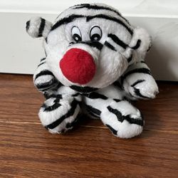 4” Plush tiger with a red nose and a keychain with a zipper pocket in back